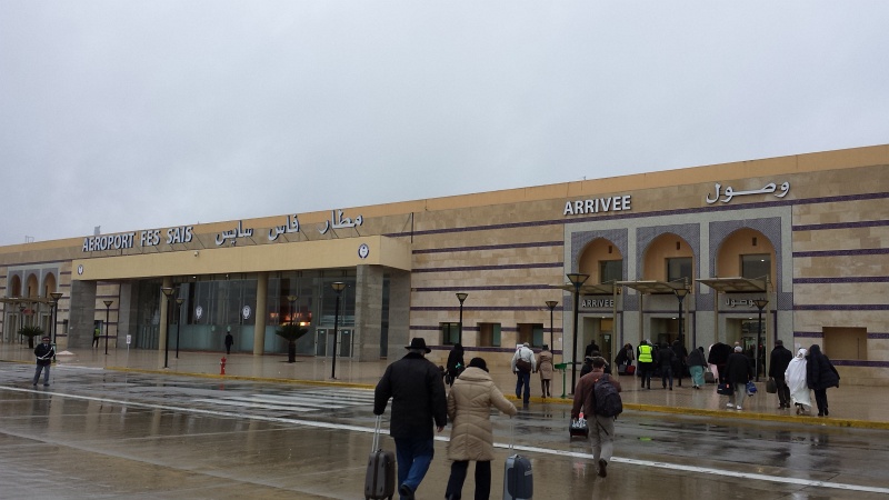 2013-11-23 17.50.24.jpg - Arrival at the the Fes airport - no jetways, no gates.  You just walk out of the plane (in light rain) with your luggage, and go straight to customs